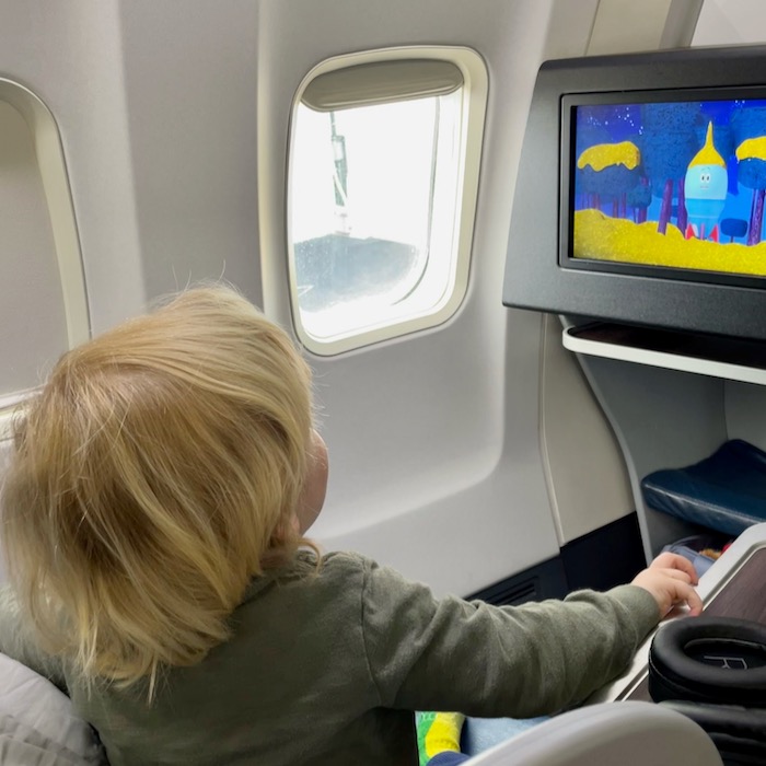 Toddler watching in-flight TV