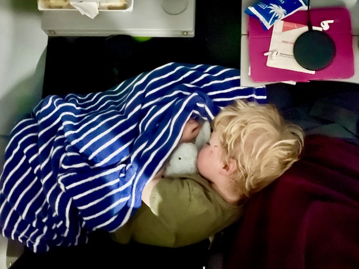 Toddler sleeping on the plane