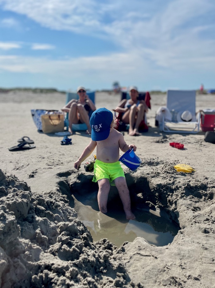 Toddler with beach pail