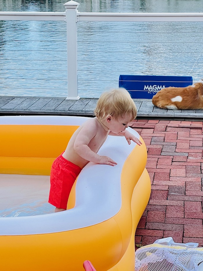 Toddler in swim trunks