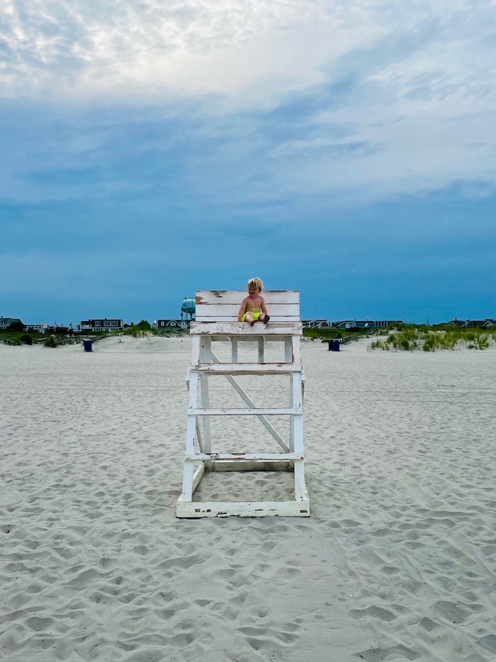 Toddler in beach lifeguard stand