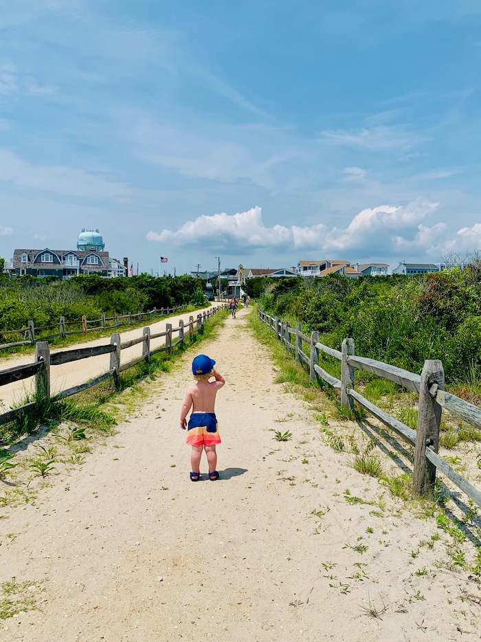 Toddler walking from the beach