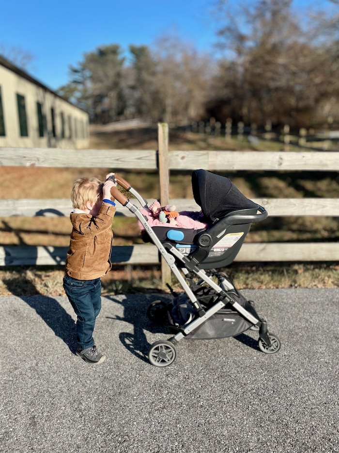 Toddler pushing UPPAbaby MINU stroller