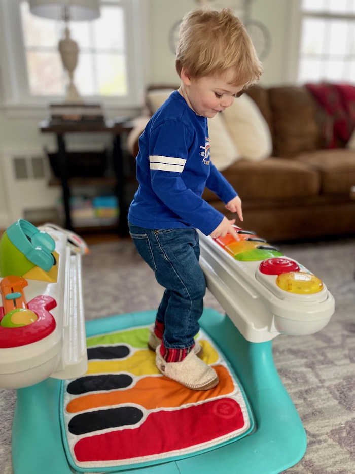Toddler in Fisher-Price 4-in-1 Step 'N Play Piano