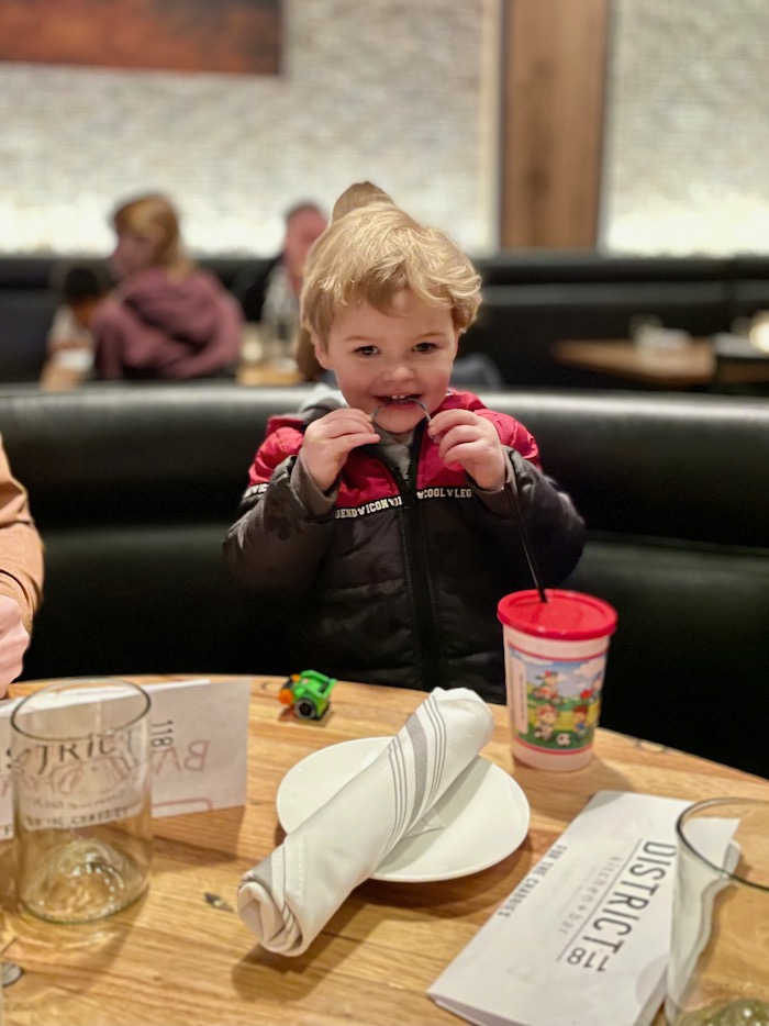 Toddler with restaurant water cup