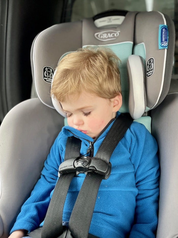 Toddler sleeping in car seat