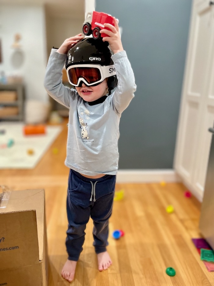 Toddler in ski helmet and goggles