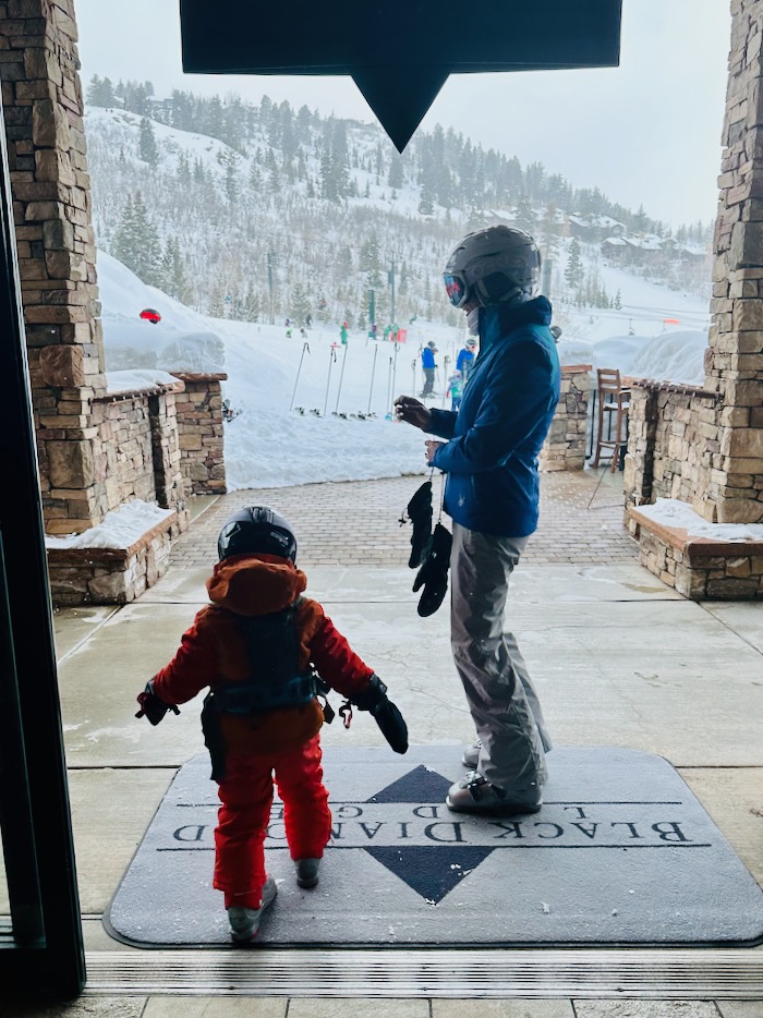 Toddler heading out to ski