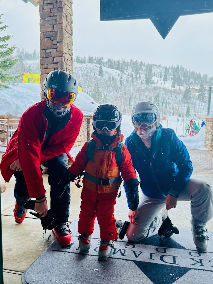Toddler and parents in ski gear