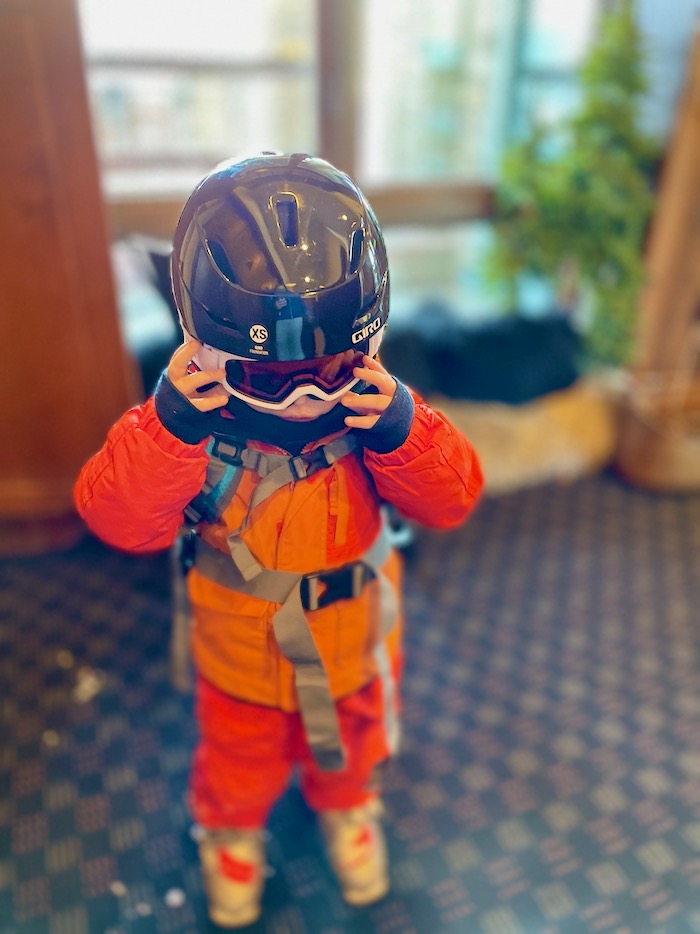 Toddler wearing ski gear
