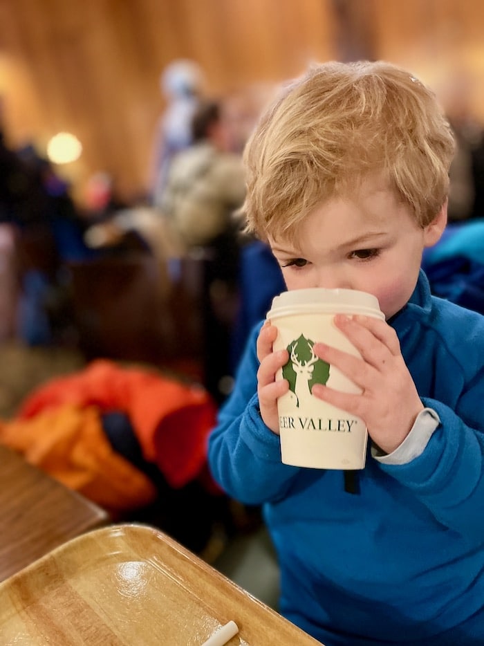 Toddler drinking hot chocolate